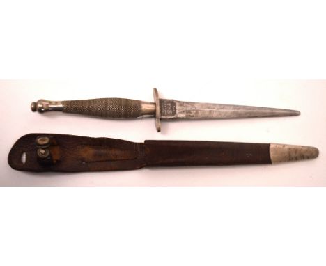 A Fairbairn Sykes First Pattern commando dagger, the blade etched for Wilkinson Sword London, in original leather scabbard, l