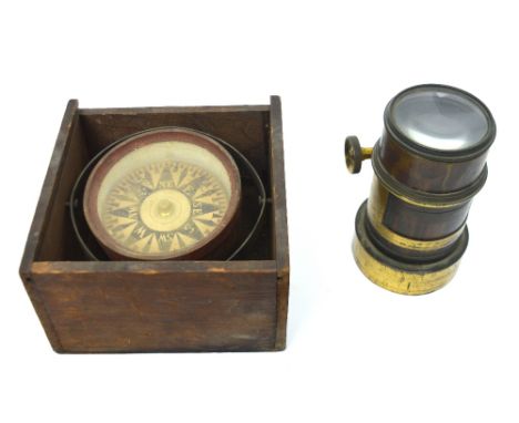 A ship's compass contained within a box with remnants of paper label, diameter 18cm and a lens inscribed 'M. F. Fench' of Fle