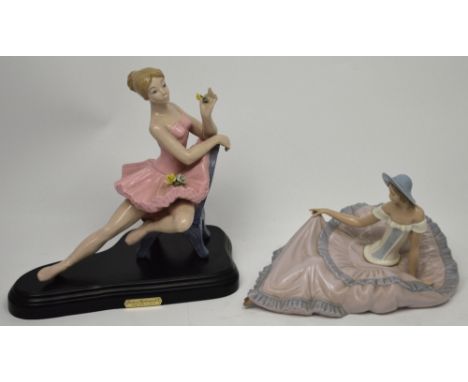 A Nao figure, a seated young girl in a flowing dress, width 30cm and a further similar porcelain figure, a seated ballerina o