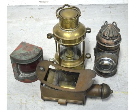 A brass ship's lamp inscribed 'Anchor', height 25cm and three further ship's lamps; one a port lamp, one inscribed 'Boat Sign