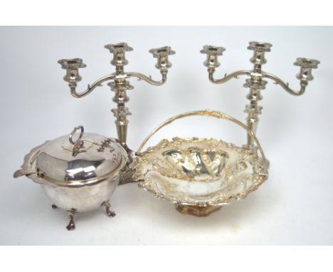 A silver plated swing-handled fruit basket, a pair of silver plated candelabra and a silver plated Mappin & Webb soup tureen 