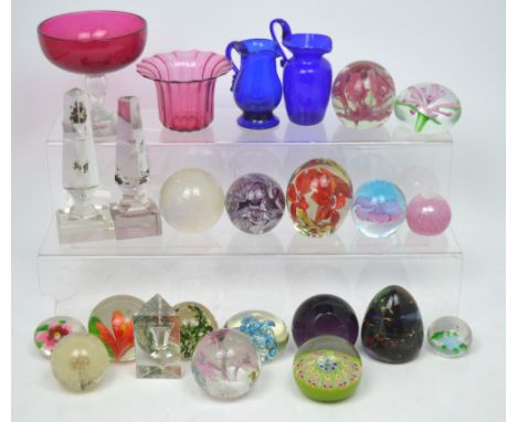 Seventeen various paperweights to include a millefiori example, a Mdina example, an example modelled as a globe etc, a furthe