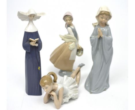 Three Nao figurines; a ballet dancer, a young girl holding a basket and a young girl in blue robe with head covering and a Ll
