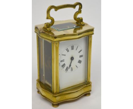 A French brass carriage clock, the dial set with Roman numerals, height 13cm.