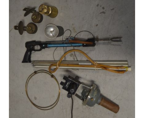 A maritime collectors' lot comprising two spear guns; one a homemade example, a 'Sailor' hand-held radio compass and further 