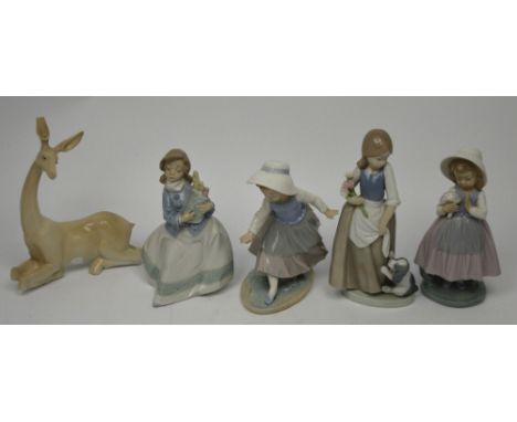 Four various Nao figures to include a young girl carry baguettes and a further Spanish porcelain model of a deer (af) (5).