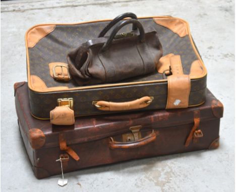 A vintage Gladstone bag and two suitcases (3).