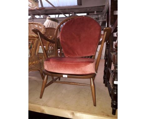 A retro dark wood Ercol armchair.  