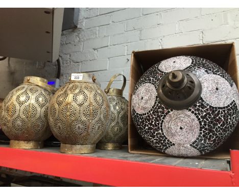 Various metal filigree candle holders and one eastern designed lamp shade.  