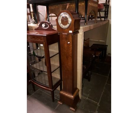 An early 20th century walnut grandaughter clock with pendulum and key, height 152.5cm.  