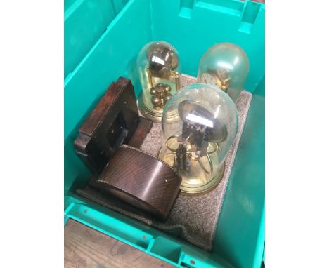 A box containing 3 400-day clocks and 2 clock cases