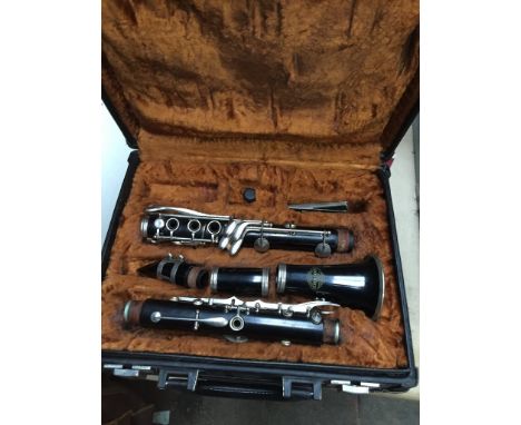 A Corton by Amati clarinet in case - incomplete.  