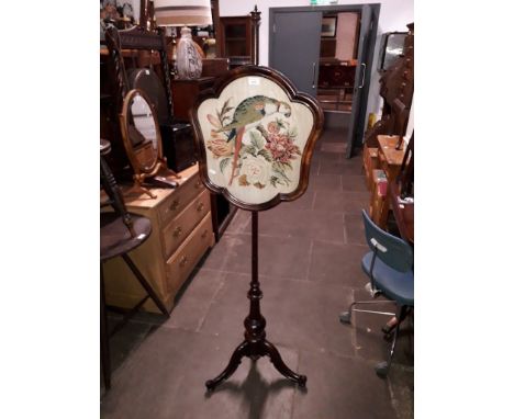A Victorian tapestry pole firescreen with parrot and flowers, height 164cm.  