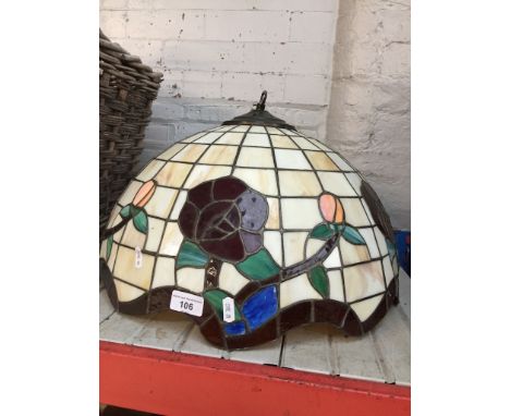 A large Tiffany style lamp shade.  