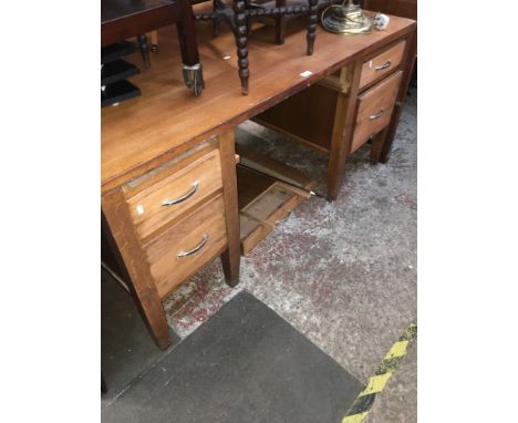 A mid 20th century oak desk, as found, height 76cm, width 152cm and depth 91cm and an oak framed firescreen with map.  