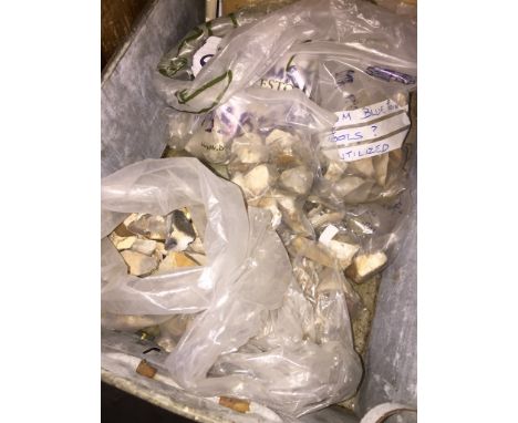 Various collections of prehistoric flint tools in metal stacking drawer.  