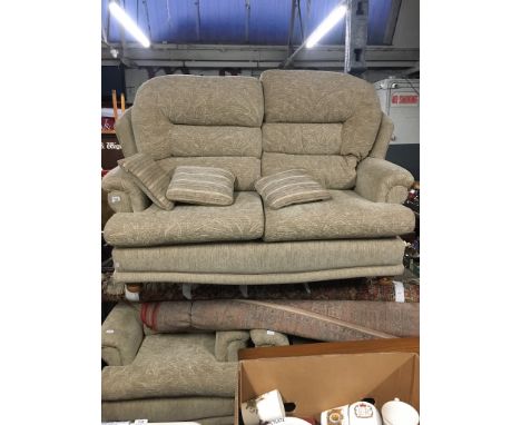 A cream upholstered two seater sofa and two matching armchairs.  
