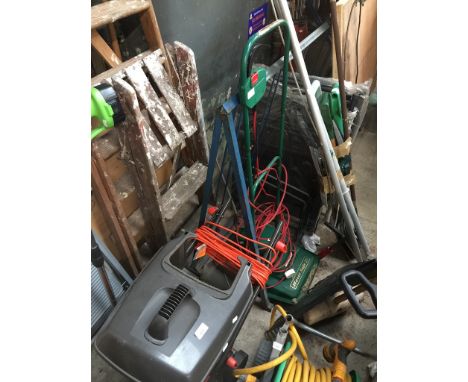 Two electric lawnmowers, a bundle of garden tools, two loppers, two garden longers and a metal step ladder  
