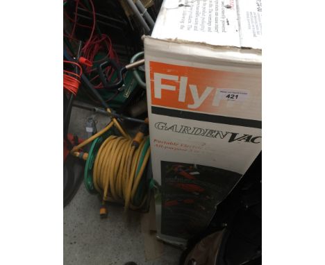 A Flymo garden vac, a garden hose reel, two portable folding tripod seats and a bundle of garden tools  