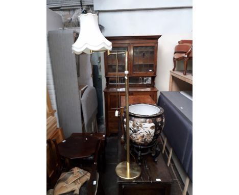 An adjustable brass standard lamp. 
