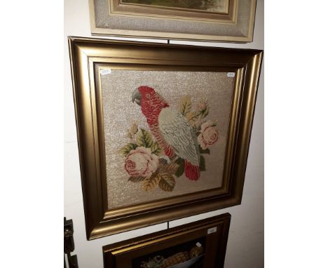 An early 20th century tapestry of a parrot, 39cm x 39cm, framed and glazed.  