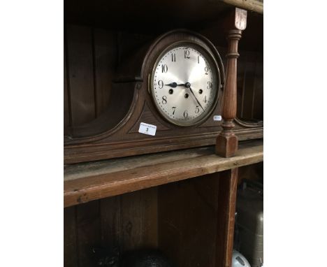 An oak cased mantle clock  