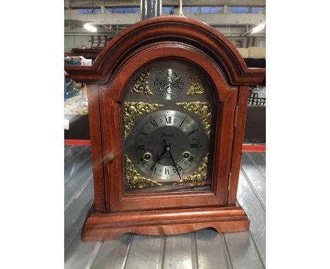 A mantle clock.After testing the mantle clock by winding it up and setting up the pendelum the clock seems to be ticking.