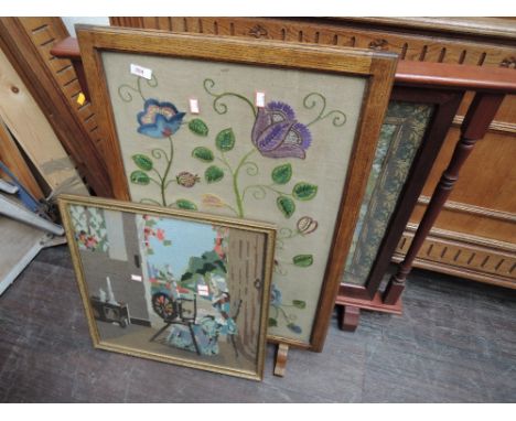 An oak framed embroidered firescreen, a late stained frame tapestry firescreen and a woolwork tapestry