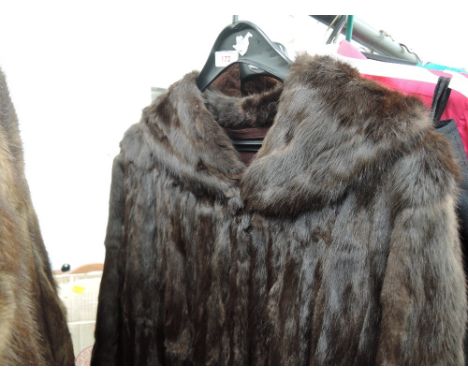 A vintage brown mink coat having shawl collar and monogrammed lining