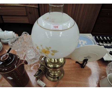 A vintage style lamp shaped like an oil burner