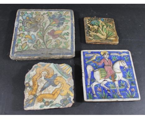 PERSIAN TILES including a Qajar style tile, painted with a falconer on horseback with a bird on one hand (16cms square, some 