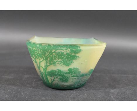 DEVEZ CAMEO GLASS BOWL of squat tapering form with a gently curving rim, cased in a dark green glass over a lighter green col