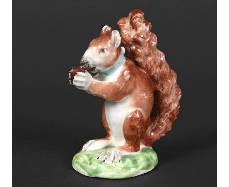EARLY DERBY PORCELAIN SQUIRREL an early 19thc porcelain model of a Red Squirrel holding a nut in it's paws. Small chips to th