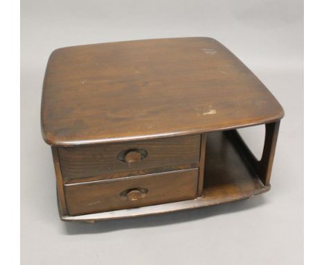 ERCOL 'PANDORA' COFFEE TABLE a dark elm coffee table of square shape, with two drawers and with roller castors. 79cms square