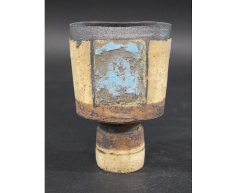 ROBIN WELCH STUDIO POTTERY VASE a small stoneware vase of compressed form and circular base, with a metallic glaze around the