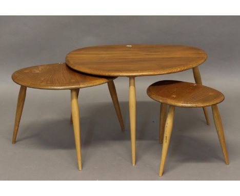 ERCOL NEST OF TABLES - PEBBLE TABLES a set of three light elm and beech pebble coffee tables, one with original label underne