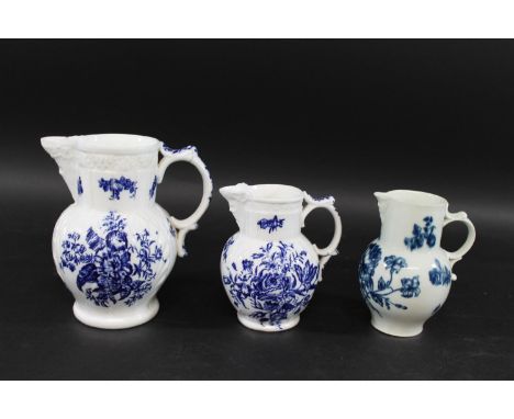 CAUGHLEY PORCELAIN BLUE &amp; WHITE JUGS including two mask head jugs of varying sizes in the Pine Cone pattern (18.5cms and 