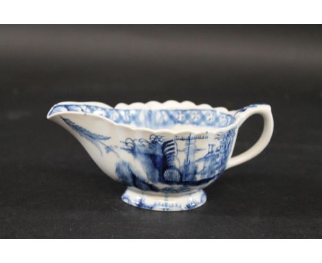 18THC PORCELAIN BLUE &amp; WHITE SAUCEBOAT a blue and white porcelain sauceboat with a scalloped shaped rim, painted with a l