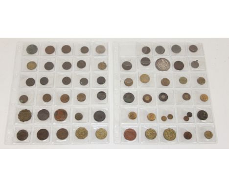 An album of assorted interesting tokens and counters, to include gaming tokens, market and advertising tokens, co-operative t