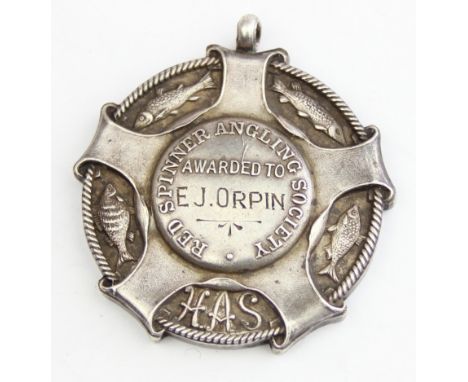 A superb quality silver fob medal awarded by The Red Spinner Angling Society, various cast silver fish set within a rope bord