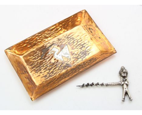 Two pieces of Peruvian silver to include a cast silver corkscrew with figure terminal, and a copper dish with silver mounted 