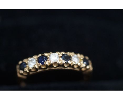 9ct Gold ring set with 4 blue stones 