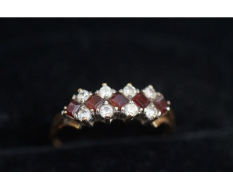 9ct Gold ring set with 5 red stones 