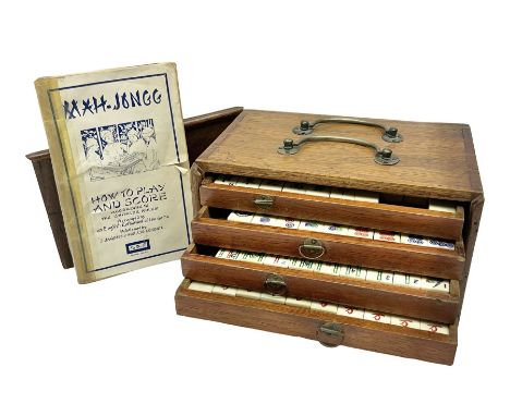 Cased mahjong set, oak case with bone and bamboo tiles and accessories