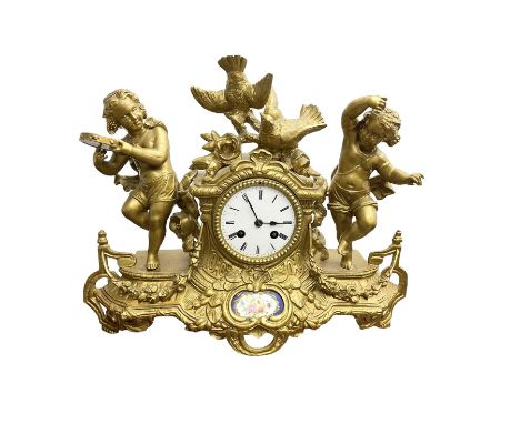 French - late 19th century 8-day  spelter mantle clock depicting two dancing children and a pair of nesting doves, white enam