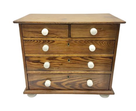 Miniature pine chest, fitted with two short and three long drawers with ceramic handles, H38cm