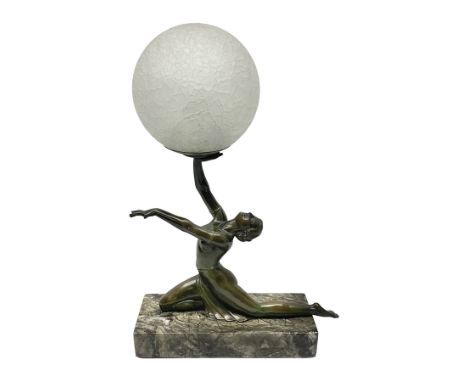 1930s Art Deco spelter table lamp, modelled as a nude woman holding aloft a spherical crizzled glass shade, upon a marble bas