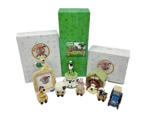 Border Fine Arts Shaun The Sheep Tractor Train and musical figure, together with a Wallace and Gromit photograph frame and a 