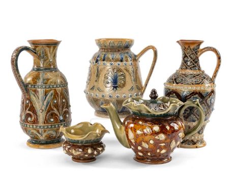 ASSORTED DOULTON CERAMICS comprising three Doulton Lambeth jugs with scroll and foliate incised decoration and applied relief