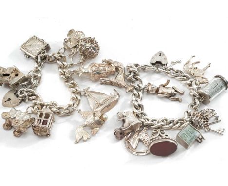 TWO SILVER CHARM BRACELETS, well filled with 9 charms each, tot appr wt. 6.3ozt (2)
